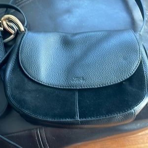 Black suede and leather crossbody bag with chain detail adjustable strap.